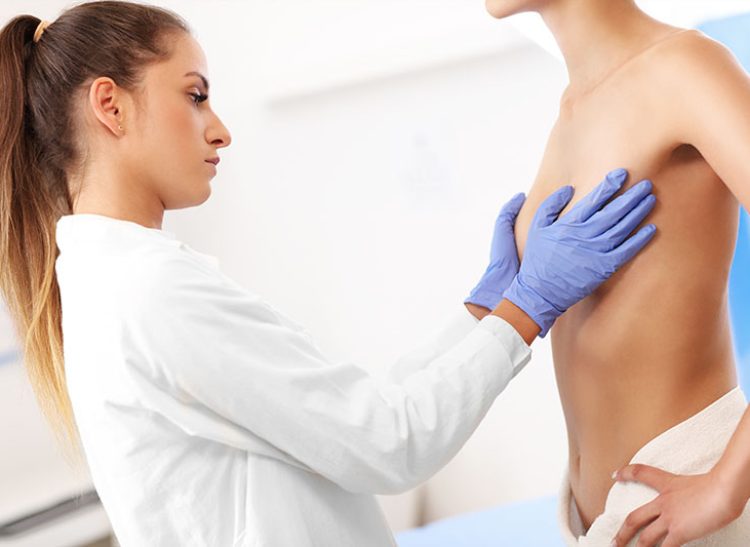 Picture of female doctor examining breast